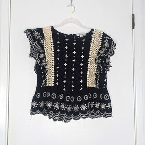 Black and white ruffle embroidered top